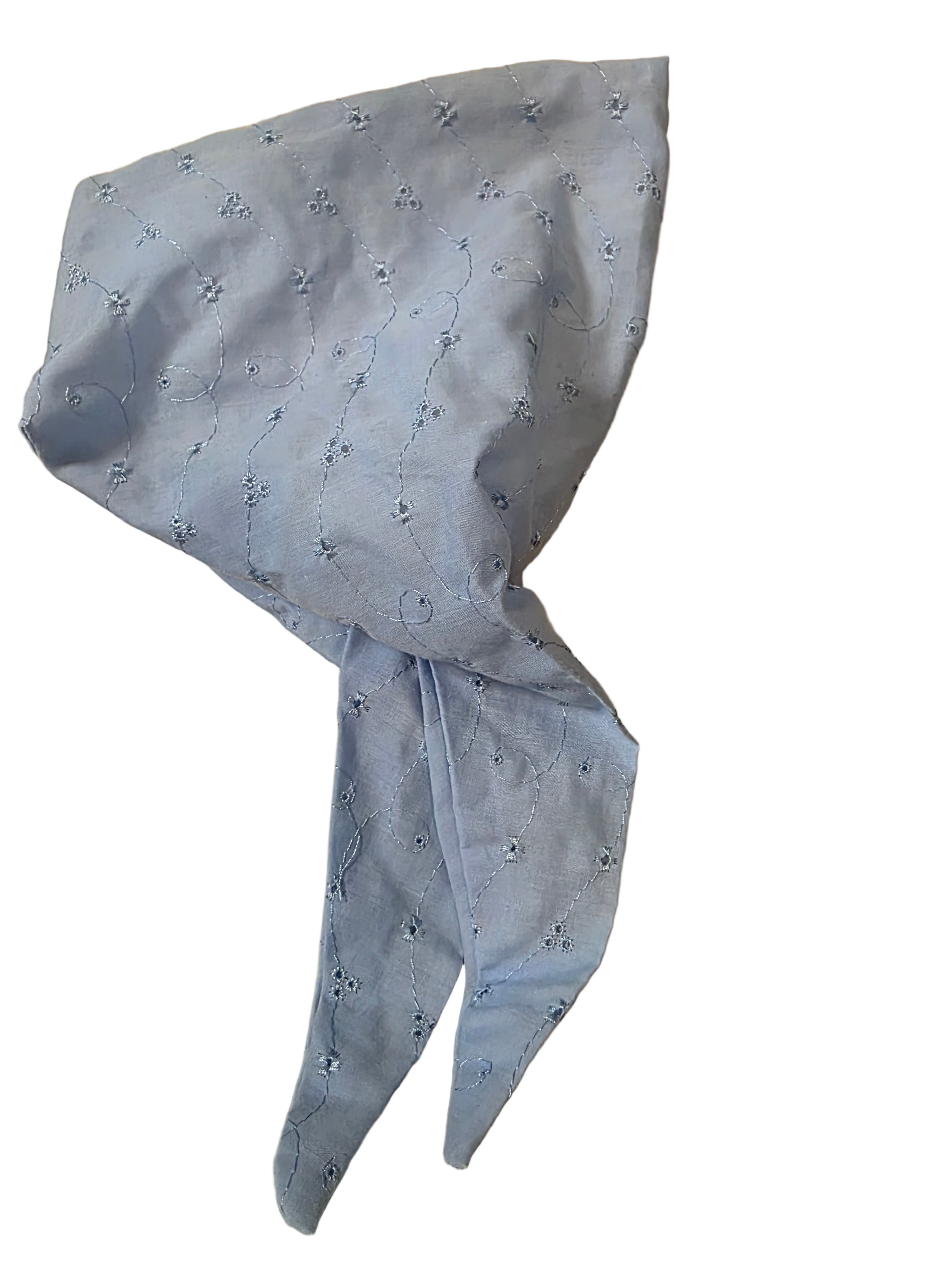 Blue fabric with floral pattern on a beige surface